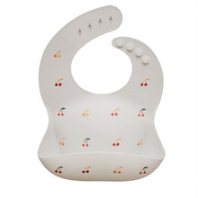 Load image into Gallery viewer, Mushie Silicone Feeding Bib